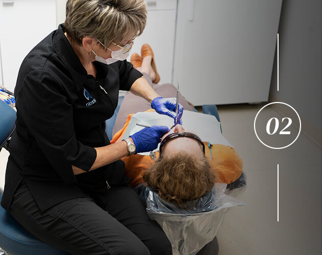 Marcia our dental hygienist examining a patient
