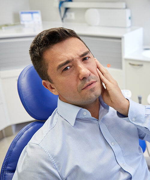Man with toothache visiting the dentist