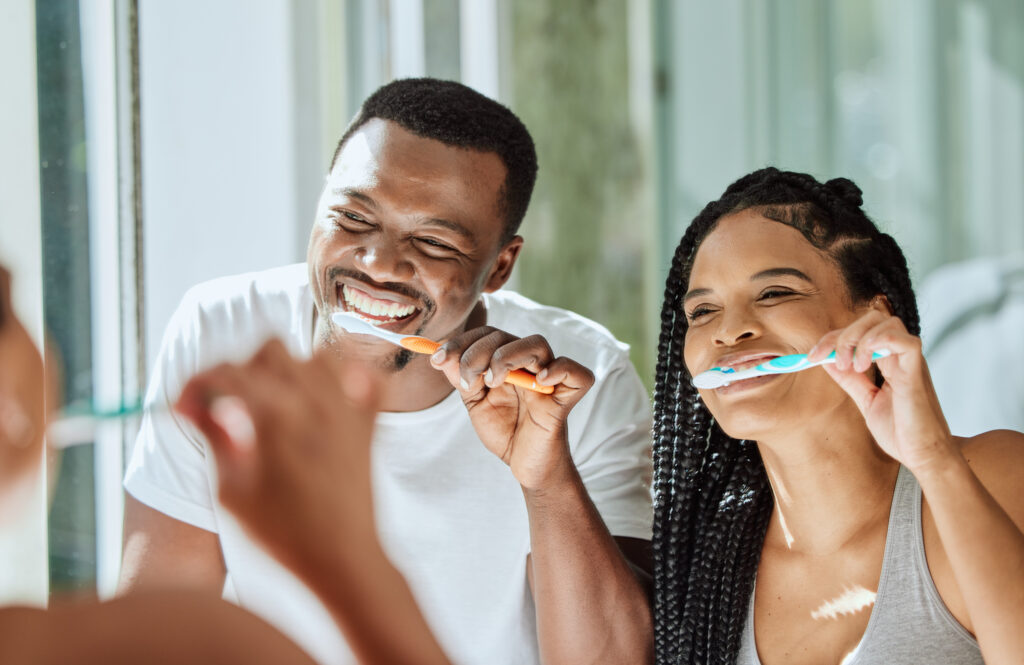 Black-couple-brushing-teeth